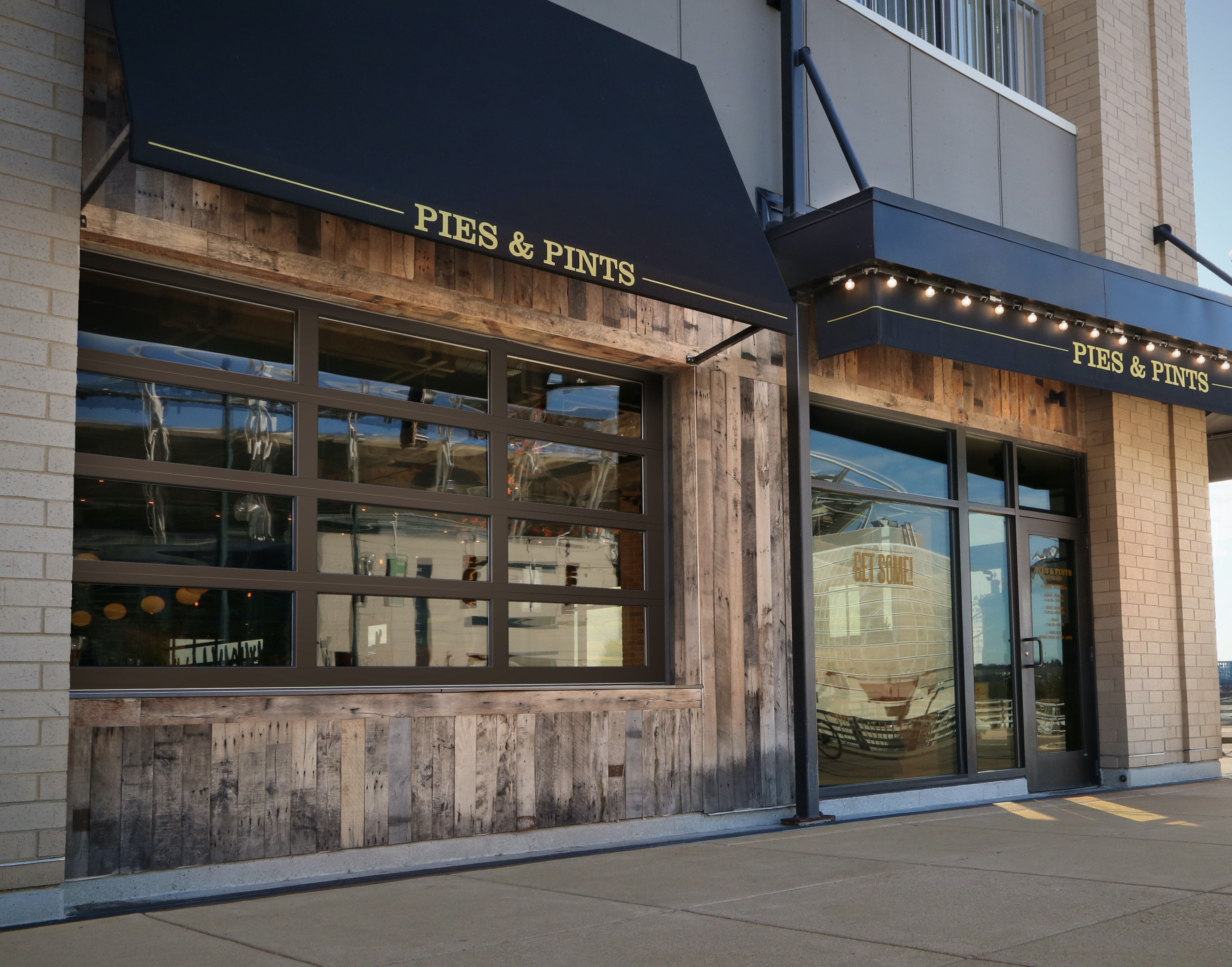 Clopay’s VertiStack compact stacking sectional door at Pies and Pints