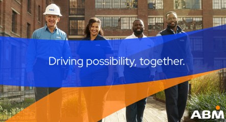 4 ABM team members in front of a brick building, with "Driving possibility, together" on blue and orange stripes