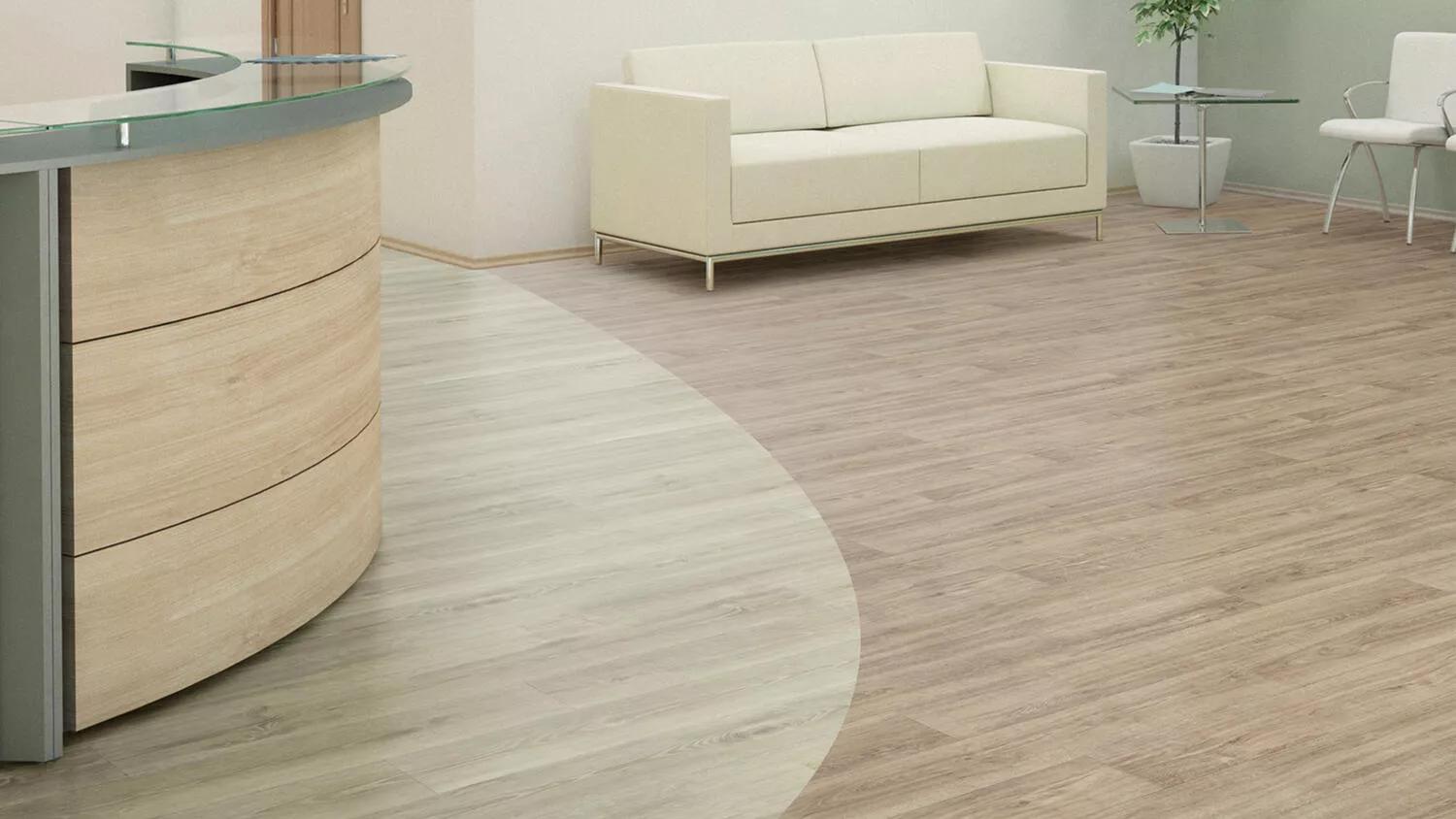 Heterogeneous flooring in healthcare office with curved desk