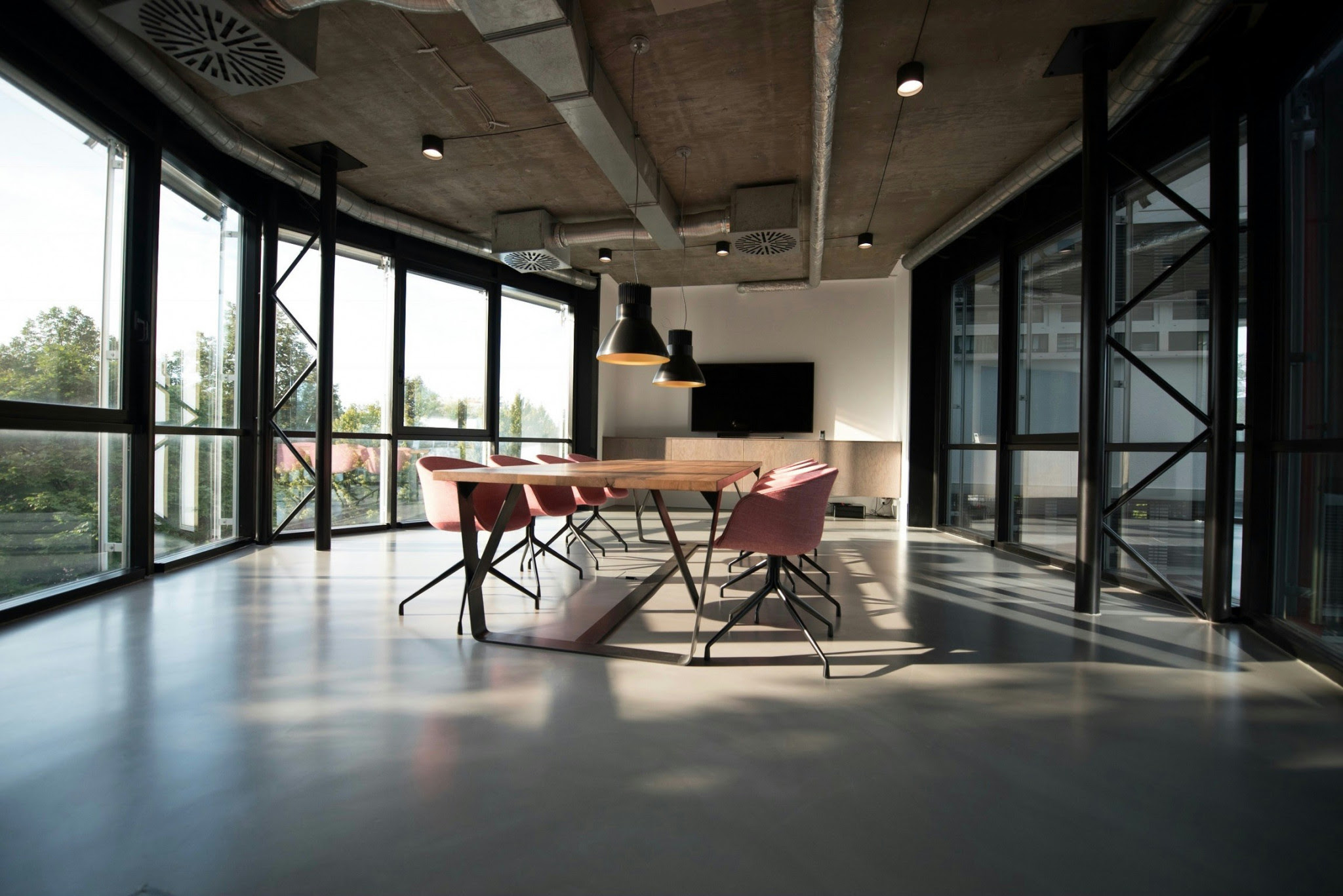 large room with big windows and conference table