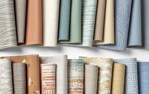 Swatches of biodegradable vinyl textiles lined up in 2 rows