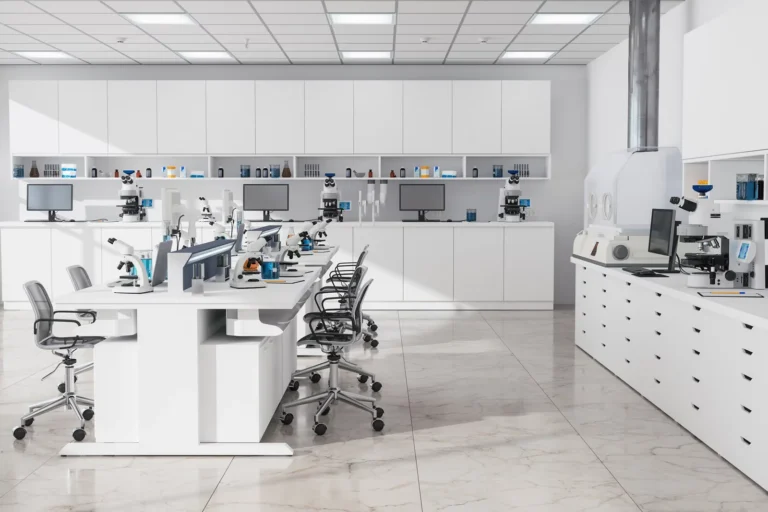 White life sciences lab with cabinets, tables, chairs and equipment