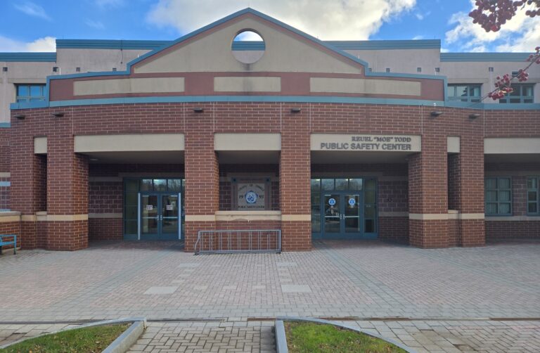 Close-up of front of brick building: Oswego County NY Public Safety Center, with jail
