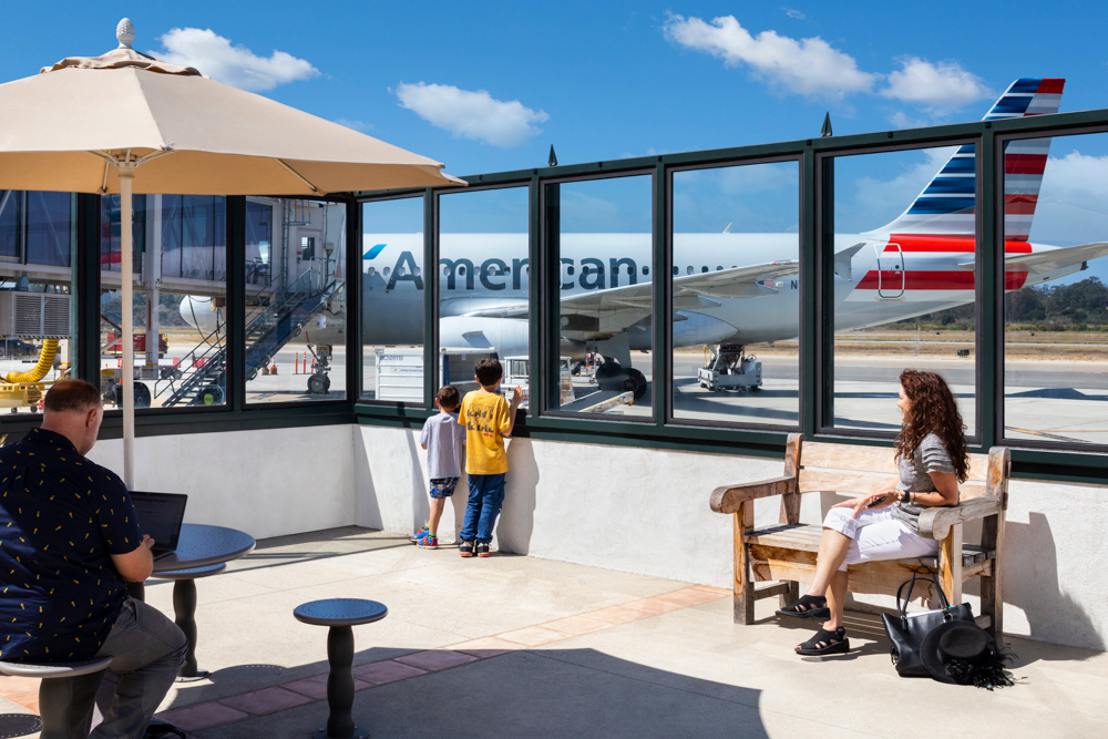 Viewing area with steel-bordered window wall at airport