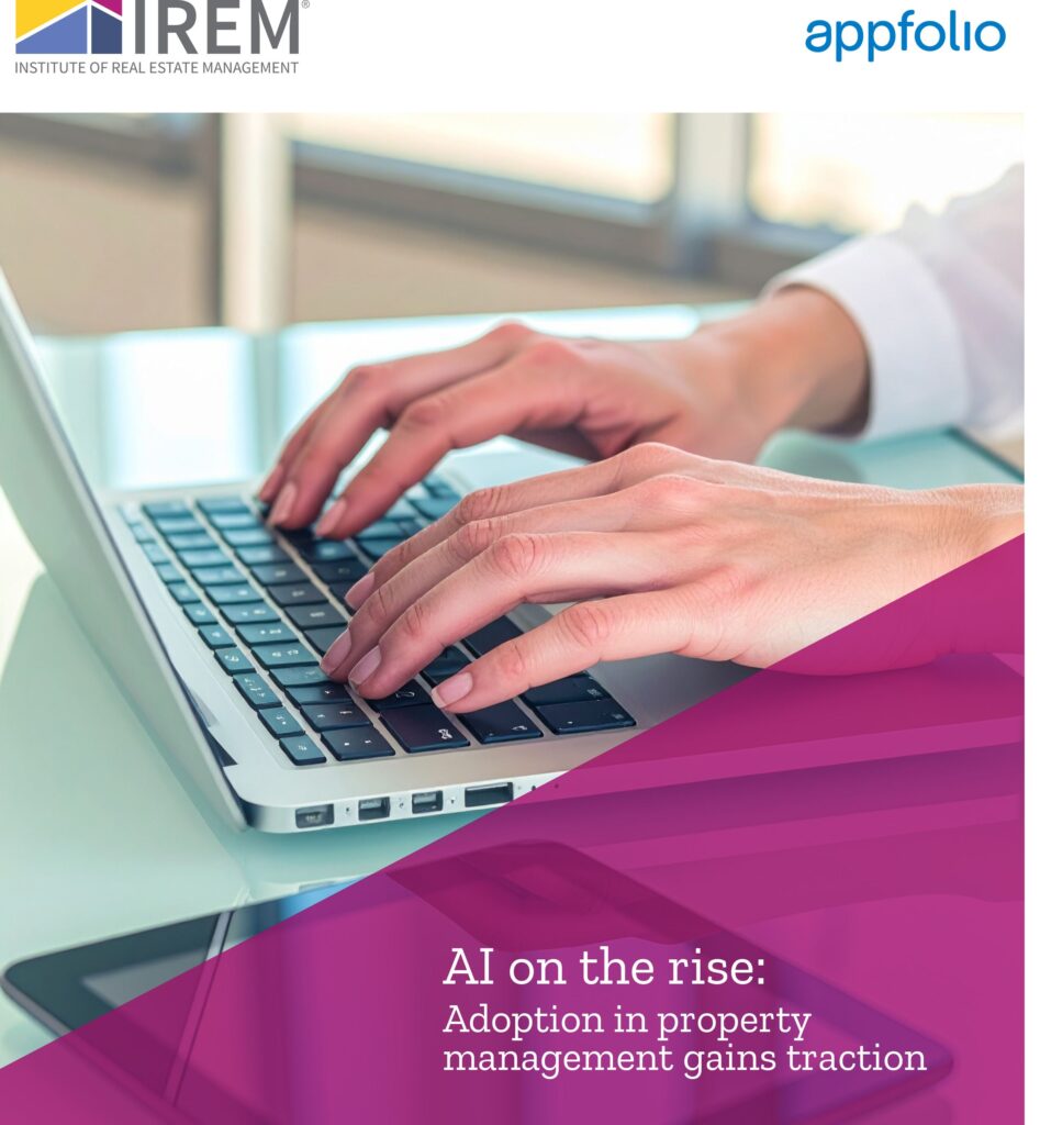 Report cover with purple triangle and person typing on laptop