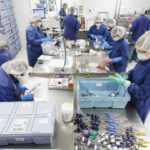 Workers in Medline ReNewal device reprocessing facility